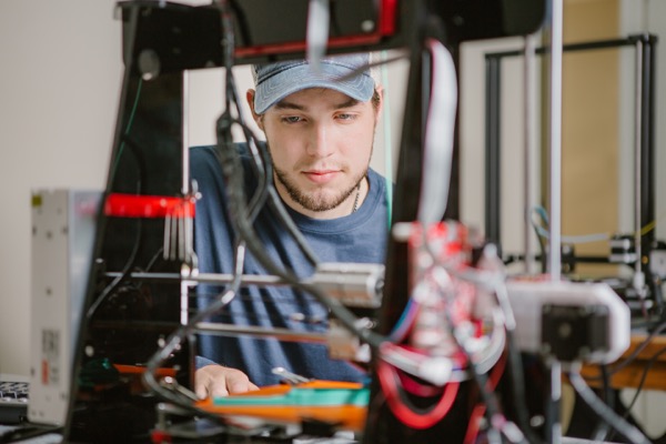 Student working with a robot