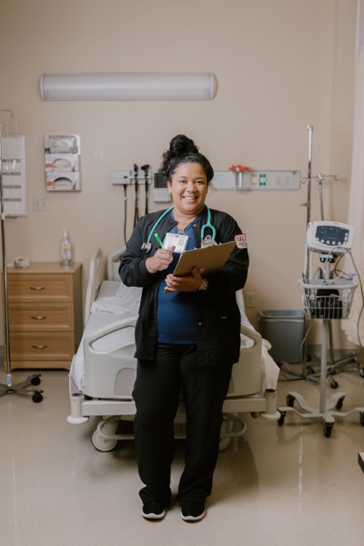 Student nurse holding clipboard